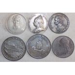 A silver Queen Victoria 1897 token, an Amelia Earhart 1932 token,