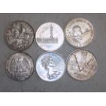 Six crown size silver World coins.