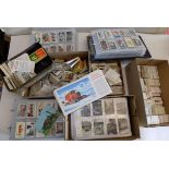 A large collection of cigarette cards in two albums, loose and in five boxes.