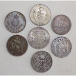 Seven World silver coins.