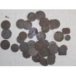 A collection of tin retail tokens, mainly Royal Arsenal.