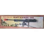 A battery operated tin plate "Heavy Machine Gun" by "T.N." made in Japan, in its original box.