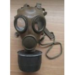Two gas masks:- German (with filter) dated 1958 and a German with filter, Nazi stamp date 8/38.