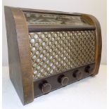 A G.E.C. wood and bakelite valve radio, height 12 1/2 inches.