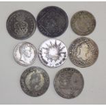 Eight 18th to 19th century World silver coins, worn or dark.