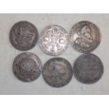 Six crown size 17th to 19th century silver coloured European coins, probable copies,