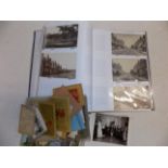 A modern album containing earlier postcards including some real photographic etc.