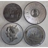 Four large alloy tokens, the larger 6.5 diameter.