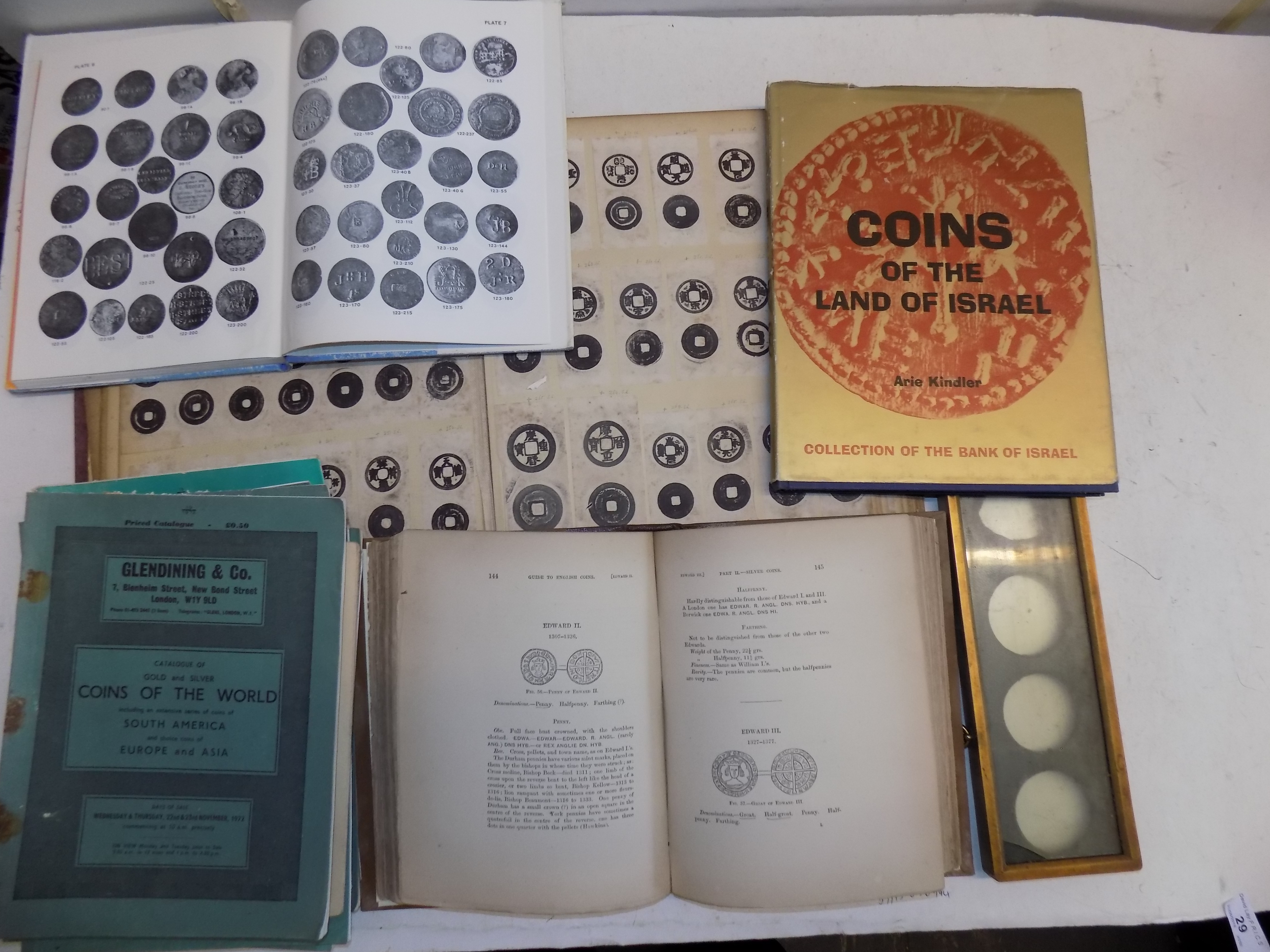 A reference book on Chinese cash, other books and a brass mount for seven medallions.