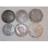 Six crown size 17th to 19th century silver coloured European coins probable copies,