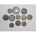Eleven 18th to 19th century mainly World silver coins.