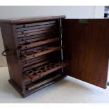 A mahogany twenty one drawer coin cabinet with twin brass swing handles, height 15",
