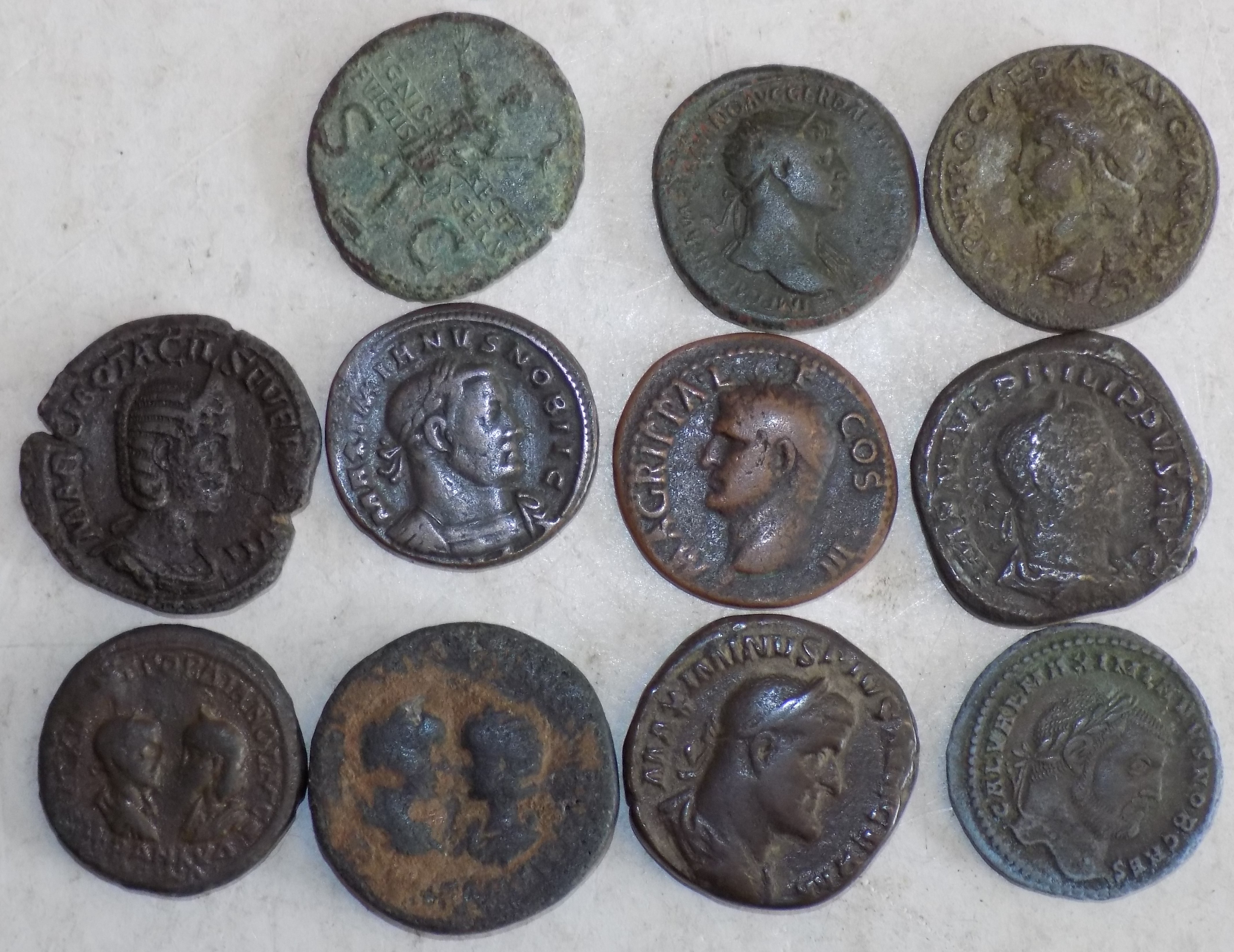 Eleven earlier Roman bronze coins.