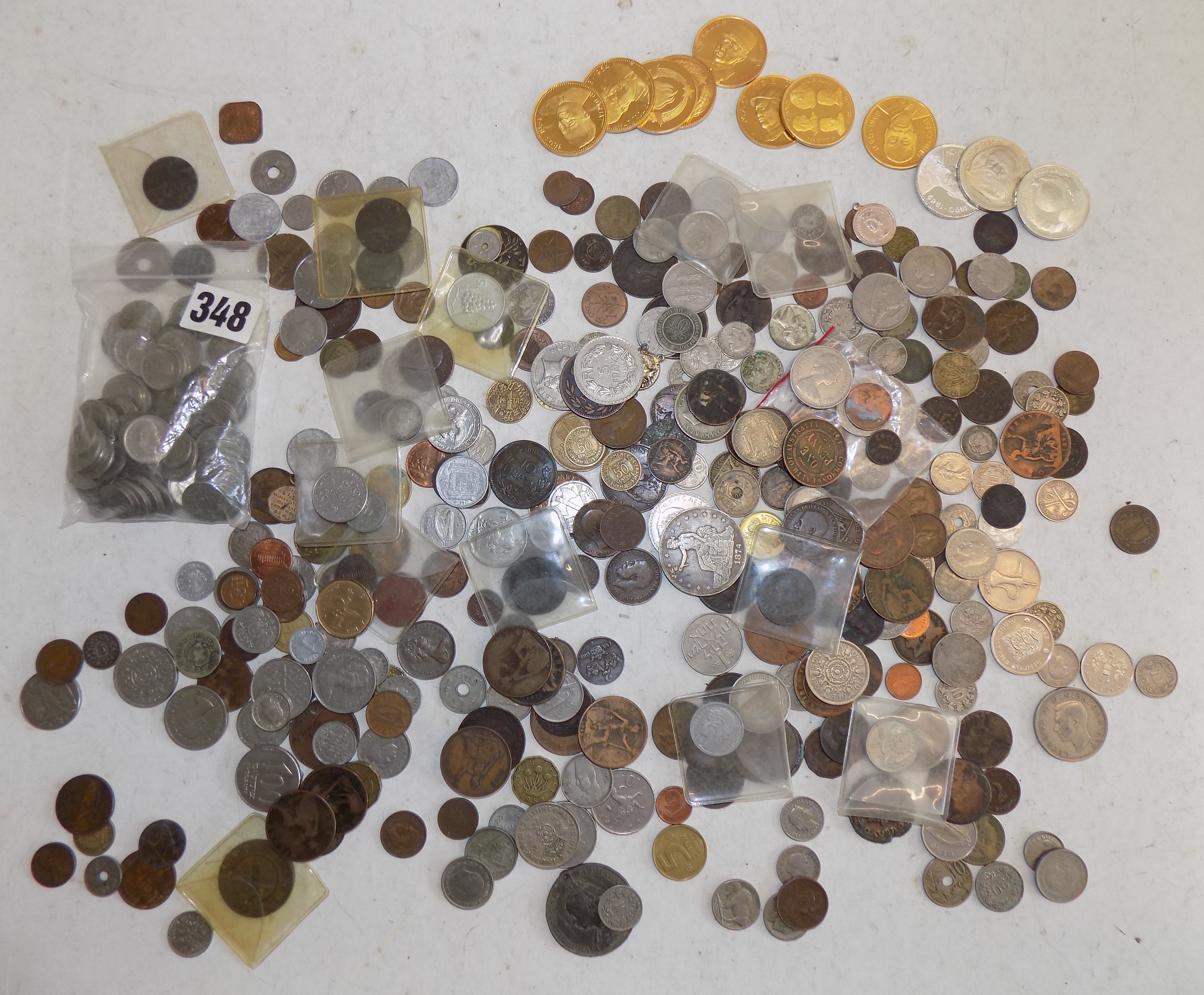 World coins, contained in a cigar box.