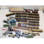 A collection of 00 gauge carriages and coaches.