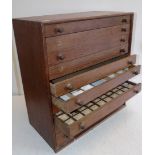 An oak ten drawer specimen cabinet, now used for coins, height 18", depth 8 1/2", width 17".