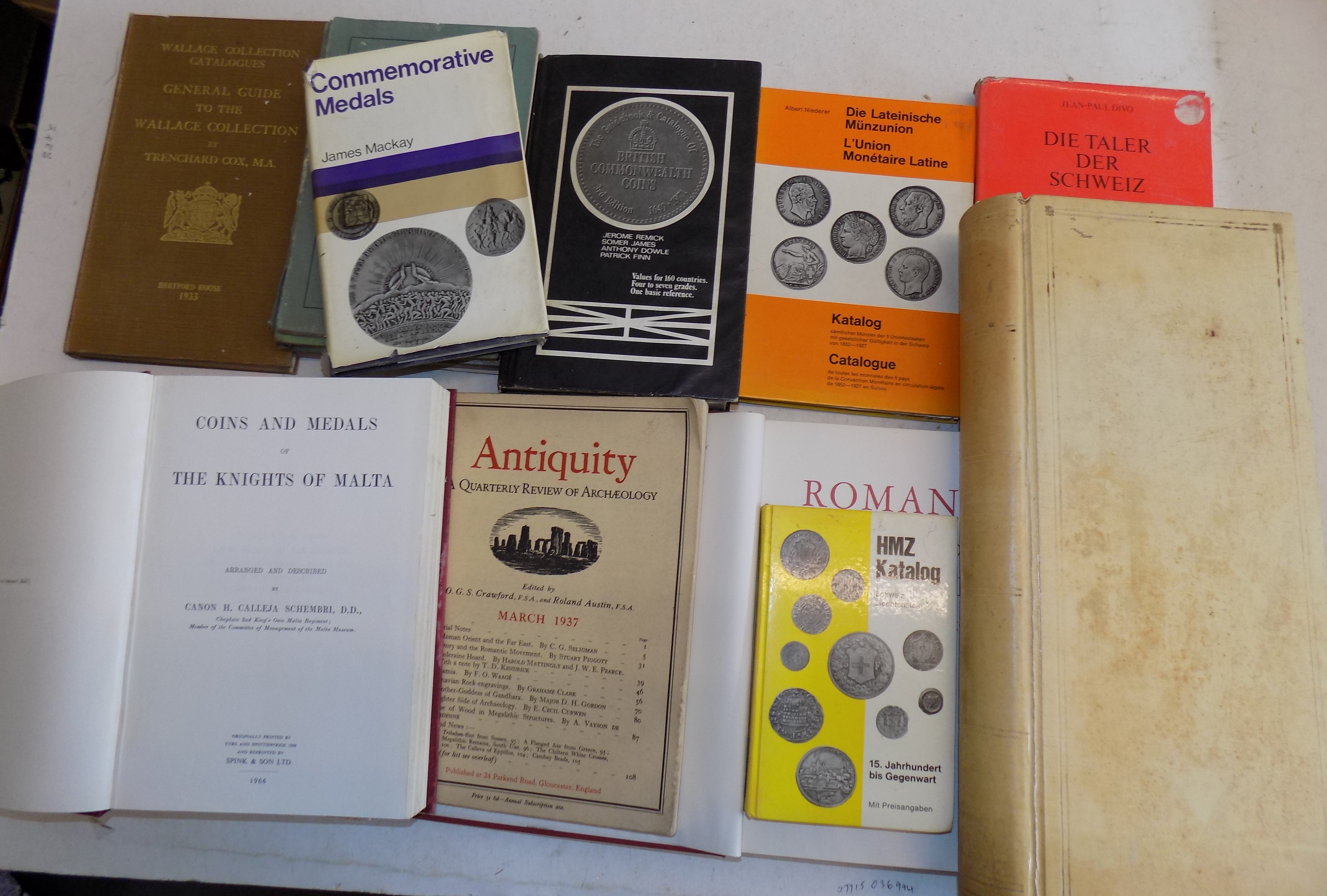 Coin reference books, a vellum ledger etc.
