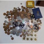 A quantity of mainly British coins contained in a mahogany box.