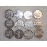 Twelve Canada silver dollars:- 1935, 1939 (2), 1950, 1951, 1955, 1957,