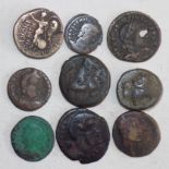 Nine Roman bronze coins.