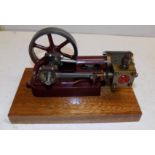 A Stuart Turner no 10H horizontal engine on wood plinth, free running.