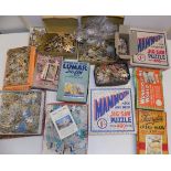 A quantity of card jigsaw puzzles, some in original boxes.