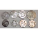 Eight World silver coins.