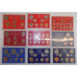 Nine various G.B. coins sets each in hard plastic case.