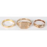 A 14ct gold Black Hills ring (worn) 2.3g, a 22ct gold band 2.5g, and a 9ct gold ring 3.9g.