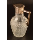 A Walker & Hall cut glass claret jug with plain silver rim lid and handle, Sheffield 1907.