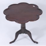 A George III mahogany pie crust tripod table,
