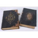 Two leather bound Holy Bibles, one with gilt metal mounts and clasps, 33.5 x 27cm.