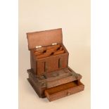 An oak stationary cabinet, with nickel mounts, lacks inkwells, height 25.