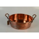 A shallow copper circular pan, inscribed S & S to base, height of body 12cm, diameter 37cm.