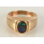 A 9ct gold ring set an opal, size T, 7.2g. Condition report: Marked 375.
