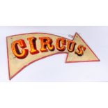 A painted 'Circus' sign, in the form of an arrow, height 66.5cm, width 123cm.