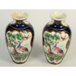 A pair of Worcester style porcelain scale blue ground baluster vases,