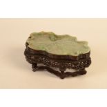 A Chinese mottled green, rust and white jade shallow tray like dish,