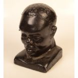 A black painted plaster bust, height 27.5cm, width 17.5cm.