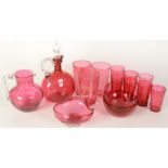 Miscellaneous cranberry glass including a decanter, two jugs, two bowls,