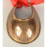 A George III copper gorget of crescent form, engraved crowned GR monogram,