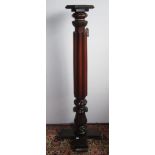 A mahogany torchiere, the hexagonal top on a turned and fluted column with a later oak base,