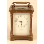 A French brass cased carriage clock retailed by Shoolbred.
