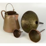 Three copper funnels and a copper jug.