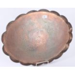 An Arts and Crafts hammered copper oval tray, 57 x 43cm.
