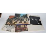 A collection of nine Beatles albums to include, The Beatles, Revolver LP, MONO PMC 7009,