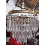 A gilt metal and cut glass waterfall chandelier.