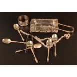 Six silver apostle spoons and a pair of matching sugar tongs, a silver napkin ring 3.