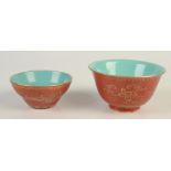 A Chinese porcelain red glazed gilt decorated tea bowl, with plain turquoise interior,