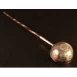 A George III silver punch ladle set with a William II sixpence.